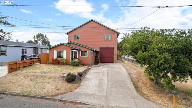 traditional-style home featuring fence and driveway