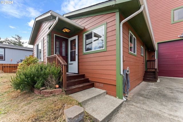 view of front of house featuring crawl space and fence