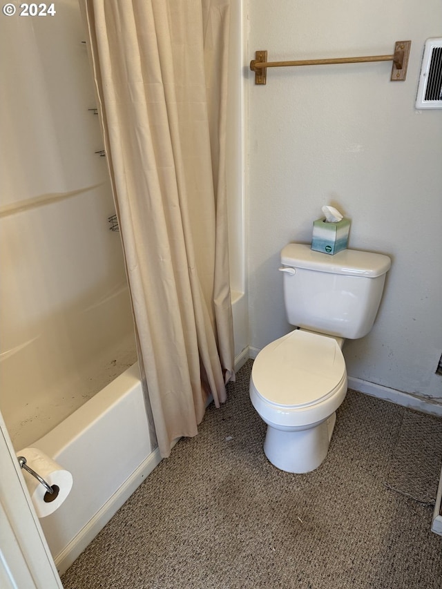 bathroom with toilet and shower / tub combo with curtain