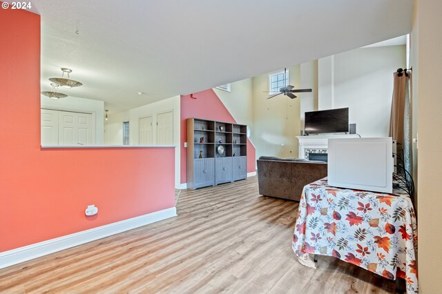 kitchen with ceiling fan and light hardwood / wood-style flooring