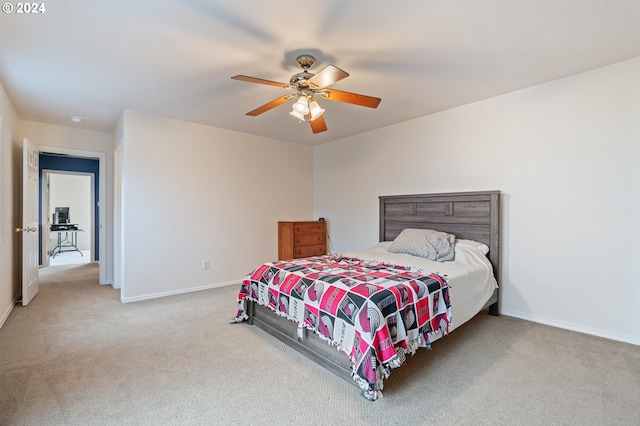 bedroom with light colored carpet and ceiling fan