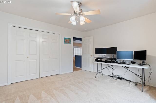 home office featuring light colored carpet and ceiling fan