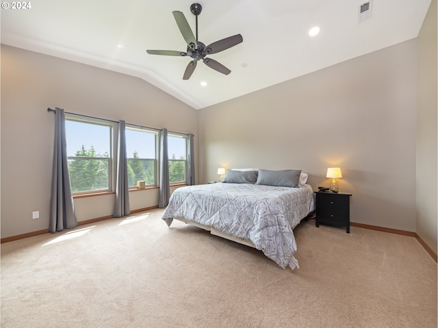 carpeted bedroom featuring lofted ceiling and ceiling fan