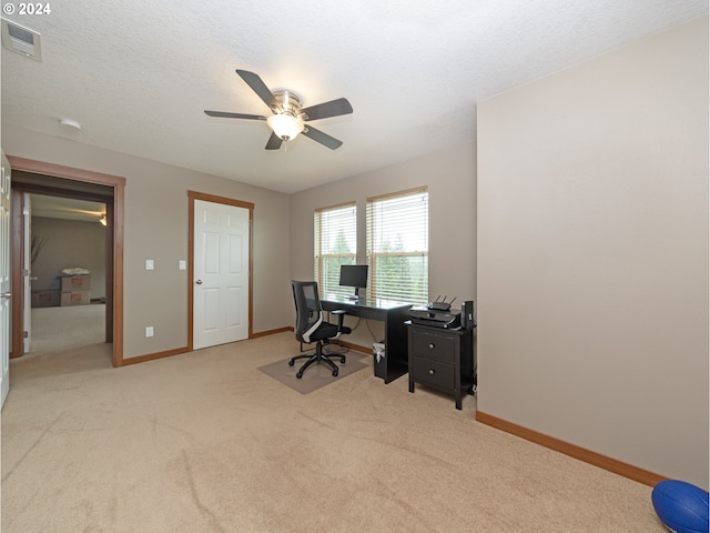 office with ceiling fan, light colored carpet, and a textured ceiling