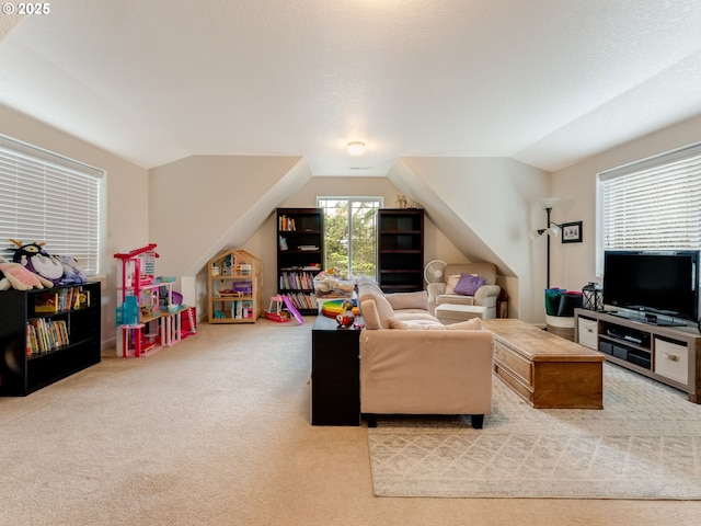 carpeted living room with a wealth of natural light and lofted ceiling