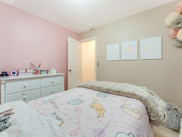 bedroom featuring a textured ceiling