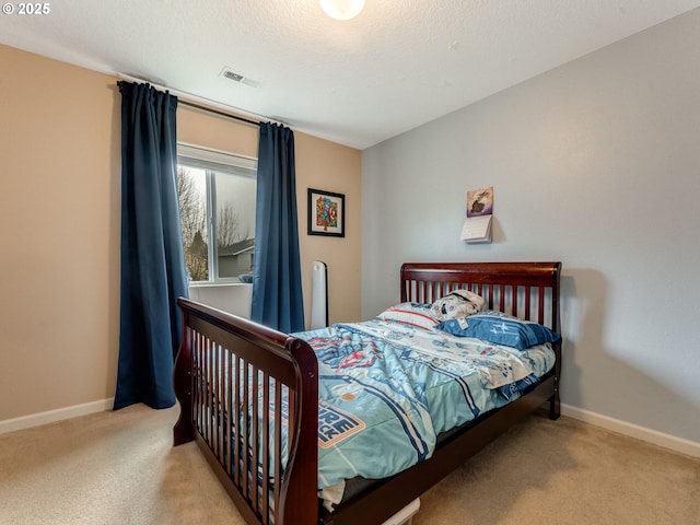 bedroom with light colored carpet