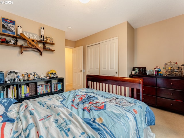 bedroom featuring light colored carpet and a closet