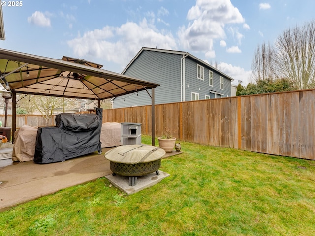 view of yard featuring an outdoor fire pit, a gazebo, and a patio