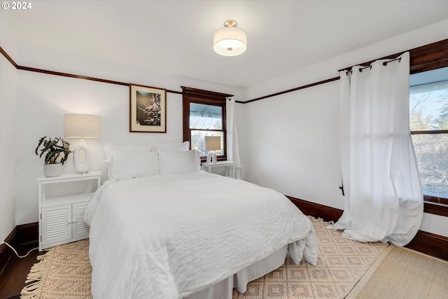 bedroom with wood-type flooring