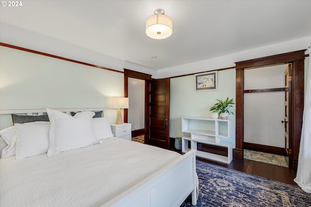 bedroom featuring dark wood-type flooring