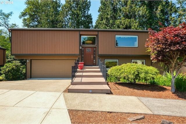 raised ranch with concrete driveway