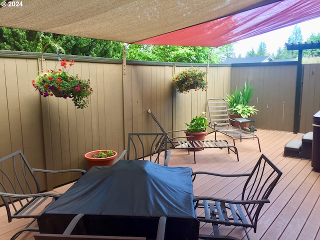 wooden terrace with area for grilling