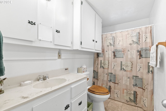 bathroom featuring tile patterned floors, curtained shower, toilet, and vanity