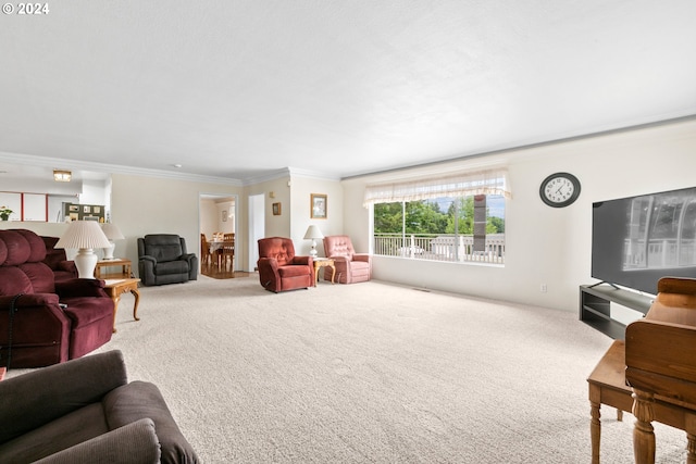 living area with crown molding and carpet flooring