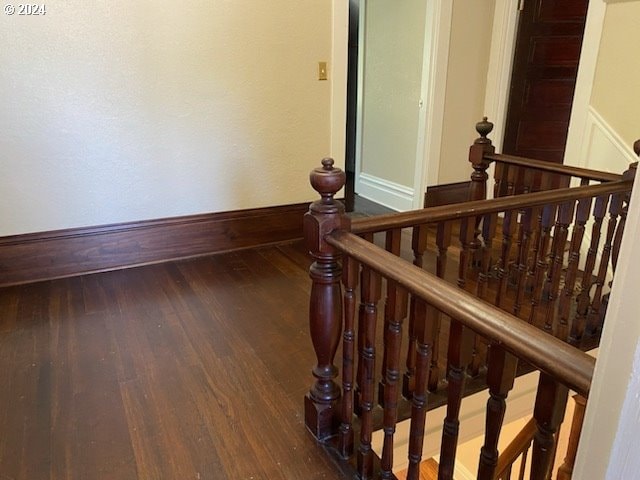 staircase featuring hardwood / wood-style floors