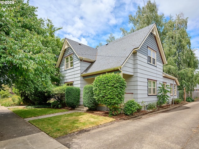 view of home's exterior with a lawn