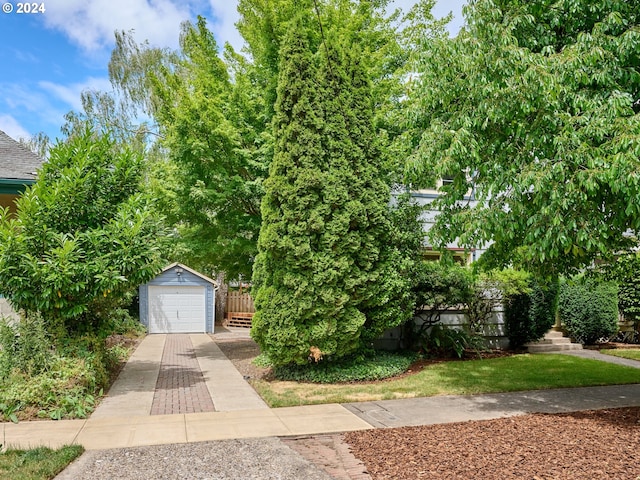 view of front of house with an outbuilding and a garage