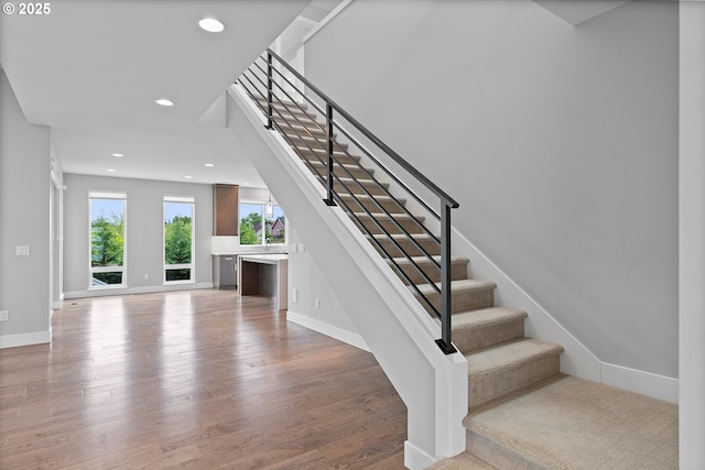 13560 SW Whitworth Ct, Beaverton, OR 97005 - staircase featuring wood finished floors, baseboards, and recessed lighting