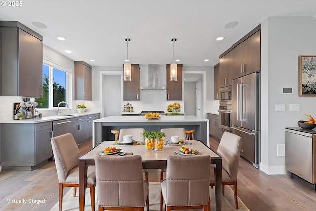 13560 SW Whitworth Ct, Beaverton, OR 97005 - dining space with light wood-type flooring, recessed lighting, and baseboards
