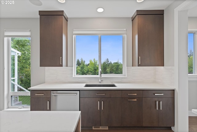 13560 SW Whitworth Ct, Beaverton, OR 97005 - kitchen featuring a sink, light countertops, tasteful backsplash, and recessed lighting