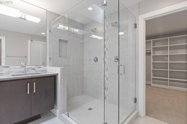 13560 SW Whitworth Ct, Beaverton, OR 97005 - full bathroom with a shower stall, tile patterned flooring, vanity, recessed lighting, and a walk in closet