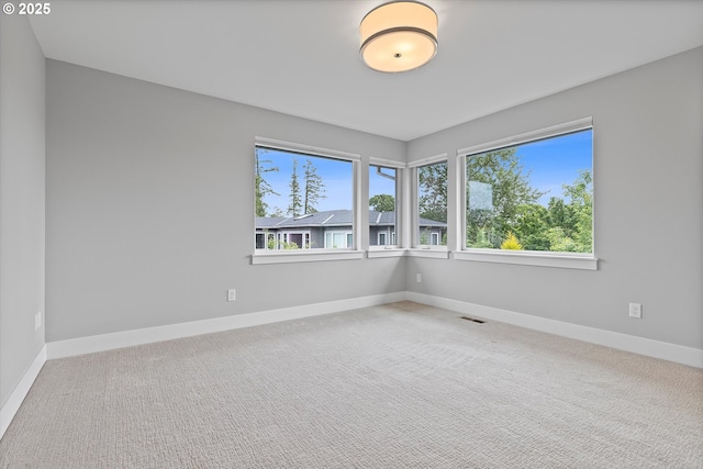 13560 SW Whitworth Ct, Beaverton, OR 97005 - carpeted empty room with baseboards