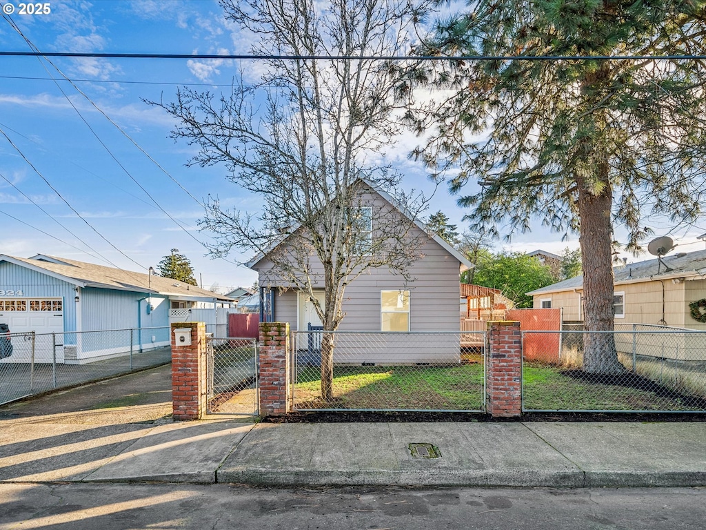 bungalow-style house with a front yard