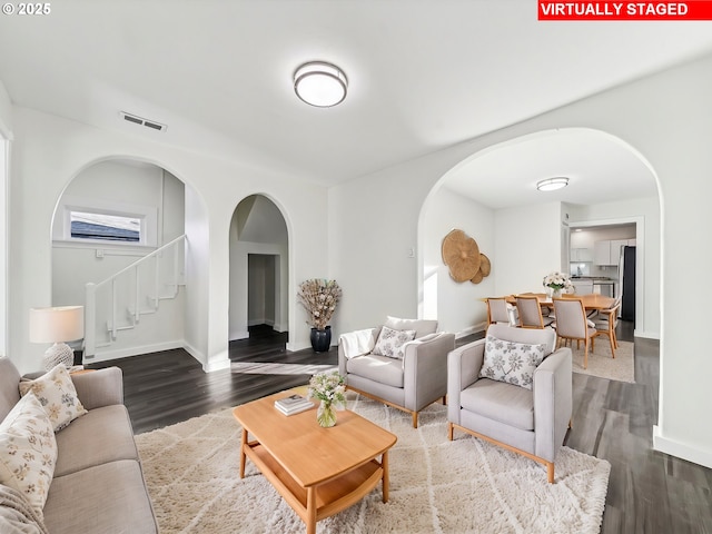 living room with dark hardwood / wood-style floors