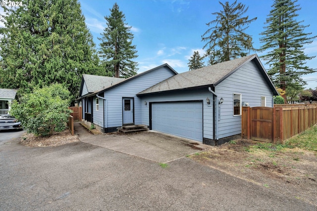 ranch-style house featuring a garage