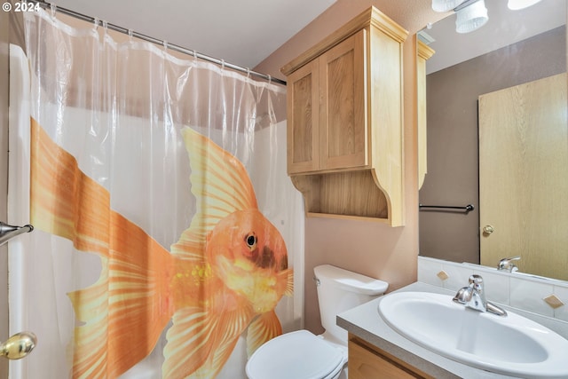 bathroom with vanity, toilet, and a shower with shower curtain