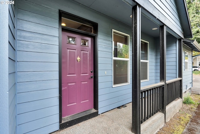 doorway to property featuring covered porch