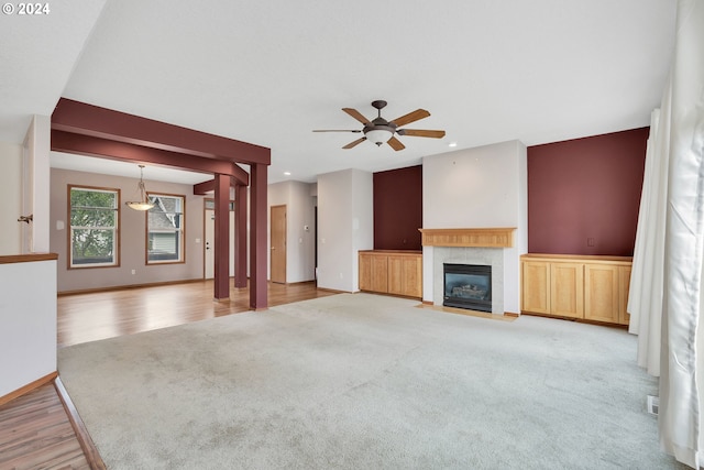 unfurnished living room with light hardwood / wood-style floors and ceiling fan