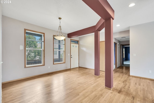 spare room featuring light hardwood / wood-style flooring