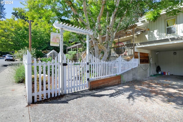 view of gate with a carport