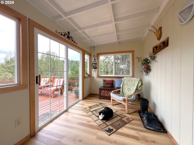 sunroom / solarium featuring beamed ceiling and coffered ceiling