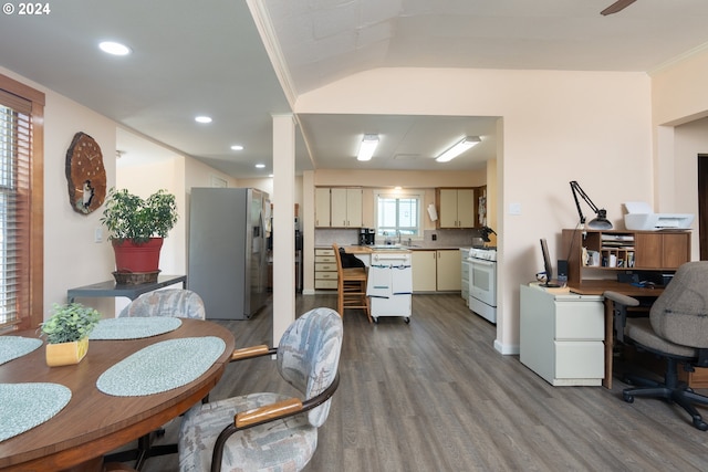 dining area featuring crown molding, a healthy amount of sunlight, and hardwood / wood-style flooring