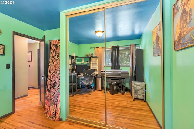 office with light wood-type flooring