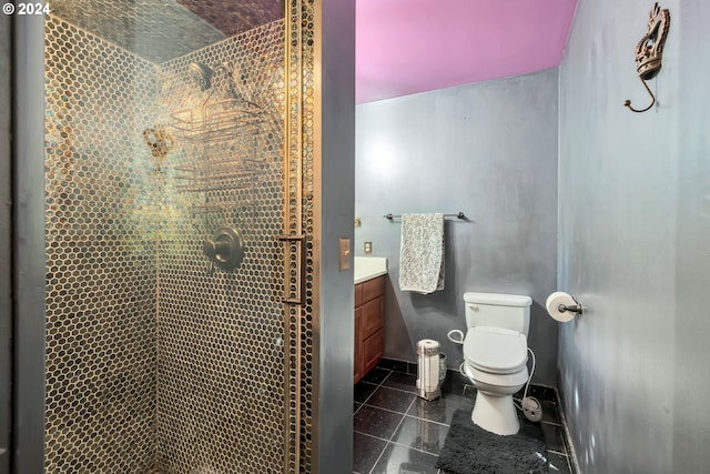 bathroom featuring a tile shower, tile patterned flooring, toilet, and vanity