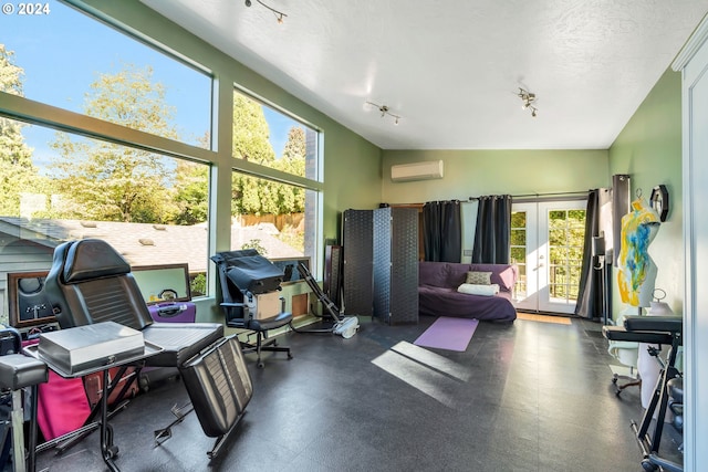 office with lofted ceiling, an AC wall unit, and a textured ceiling