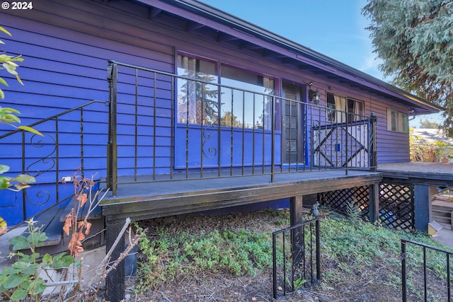 view of side of property with a wooden deck