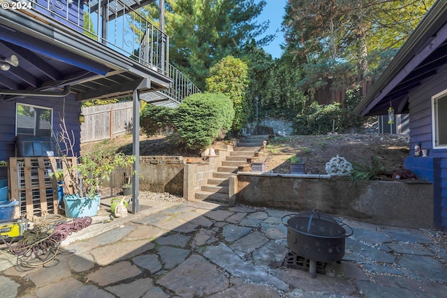 view of patio / terrace featuring an outdoor fire pit