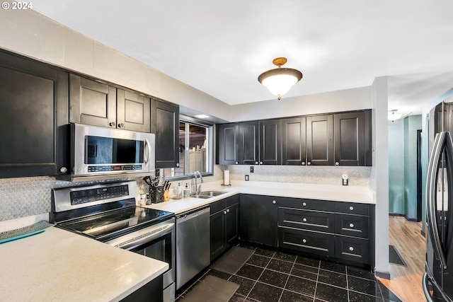 kitchen with dark wood-type flooring, sink, and stainless steel appliances