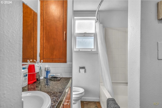 bathroom with shower / bath combo, toilet, tile patterned floors, vanity, and backsplash