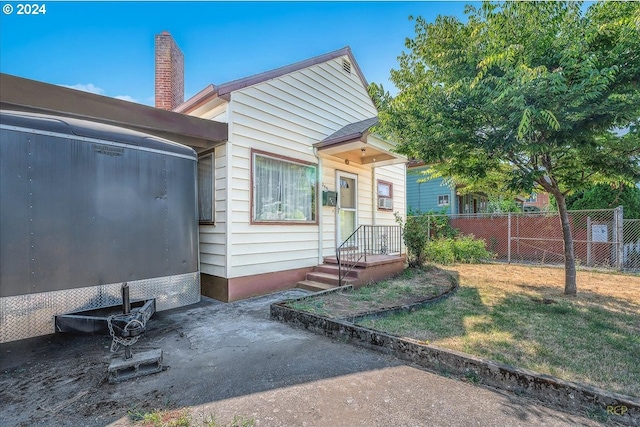 exterior space featuring a front lawn