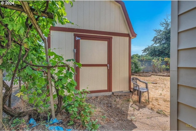 view of shed with fence