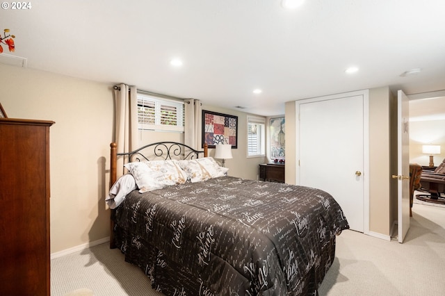 bedroom featuring light colored carpet