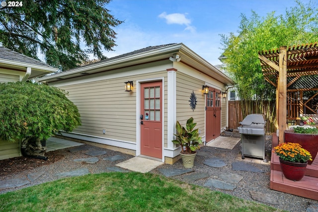 view of outbuilding featuring a pergola