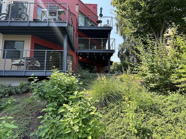 view of home's exterior with a balcony