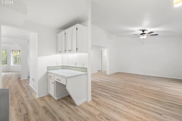 kitchen featuring ceiling fan, white cabinetry, and light hardwood / wood-style floors